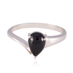 Naomi black solitaire ring with pear-shaped black stone set on a sleek silver band