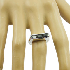 Teresa black trilogy gemstone ring with three black stones on silver band worn on finger