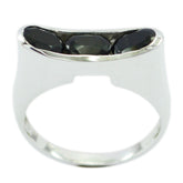Teresa black trilogy gemstone ring featuring three black gemstones set in a silver band