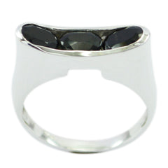 Teresa black trilogy gemstone ring featuring three black gemstones set in a silver band