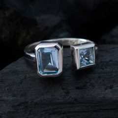 Liyana blue abstract toi et moi ring featuring two bezel set aquamarine stones in sterling silver band