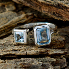 blue abstract toi et moi ring by Liyana sterling silver open band with emerald and square blue gemstones