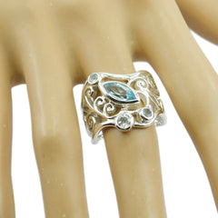 Yasmin silver blue filigree gemstone ring with marquise blue center and scroll filigree band on hand