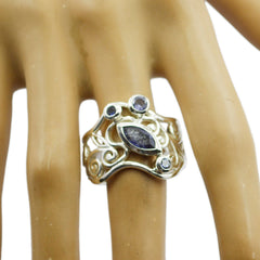 Gabriela blue filigree gemstone ring with intricate silver design worn on finger