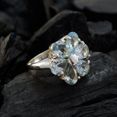 Lucia blue floral gemstone ring with clear blue petals set in silver band