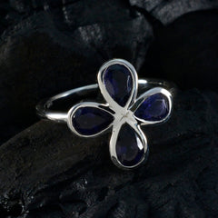 Nella blue floral gemstone ring with four deep blue teardrop stones set in silver band