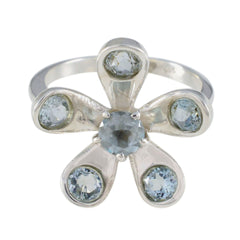 Claire blue floral gemstone ring with silver band and light blue stones arranged in flower shape