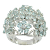 Dayana blue floral statement ring with light blue gemstones arranged in flower shapes