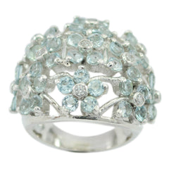 Dayana blue floral statement ring with light blue gemstones arranged in flower shapes