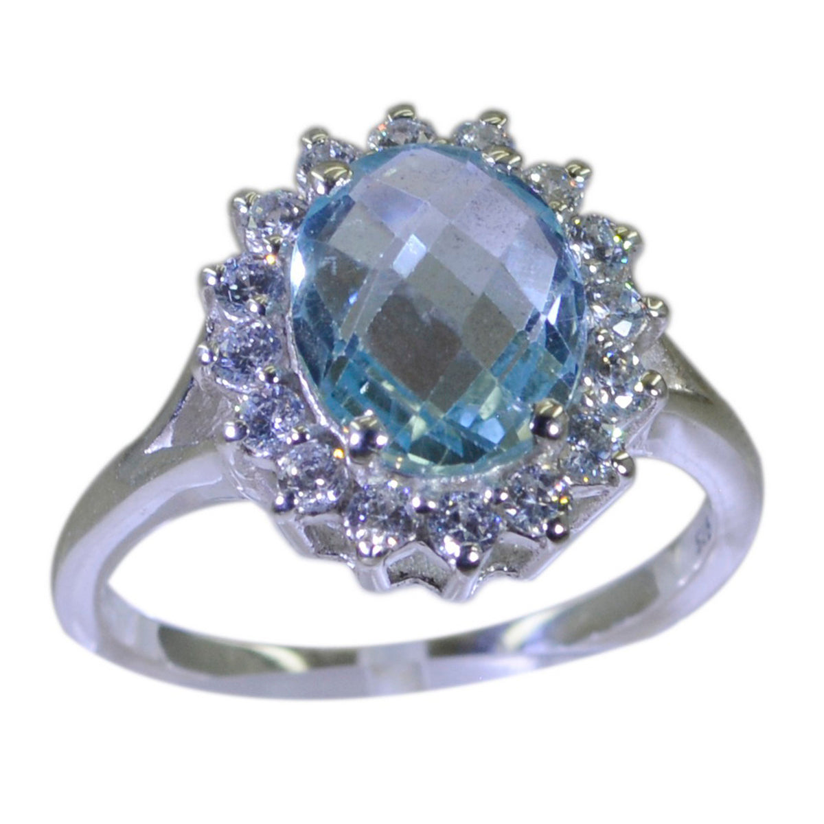 Violet blue gemstone fashion ring with oval faceted blue stone haloed by sparkling clear crystals on silver band