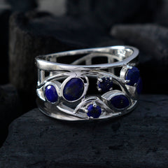 Nora blue gemstone filigree ring with intricate silver band and multiple blue stones