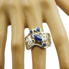 Priya blue gemstone filigree ring with intricate silver design worn on finger