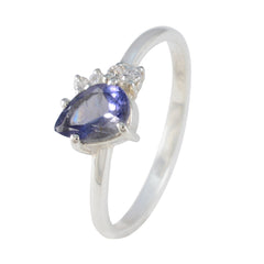 Min-seo blue gemstone halo ring with pear-shaped blue stone and silver band