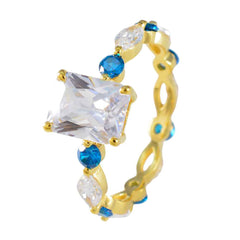 Carla gold ring with large square clear center stone and alternating blue accents blue gemstone ring for women