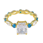 Carla gold band ring with emerald cut clear center and alternating blue accent stones blue gemstone ring for women