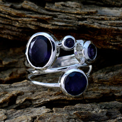 Patricia blue gemstone ring for women with multiple oval and round blue stones set in silver band