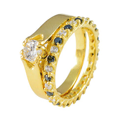 Sakura gold stacked ring set with solitaire clear stone and alternating sapphires blue gemstone ring for women