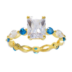 Carla gold ring with rectangular clear center stone and round blue accents blue gemstone ring for women