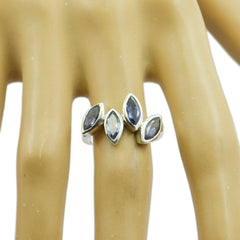 Meera silver blue gemstone ring for women with four marquise-cut stones on display finger