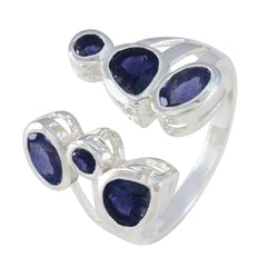 Genesis blue gemstone statement ring with multiple deep blue stones set in silver band