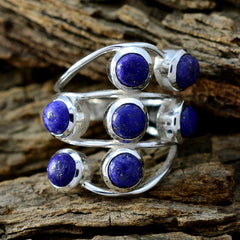 Andrea silver ring featuring multiple blue gemstones blue gemstone statement ring on rustic wood background