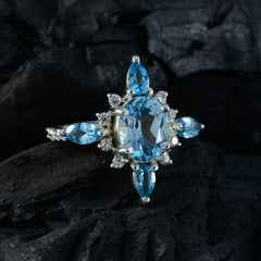 Marie blue gemstone statement ring with multiple oval and pear-shaped blue stones on silver band