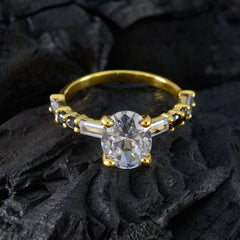 Riya gold ring with clear stones featuring a blue gemstone statement ring design