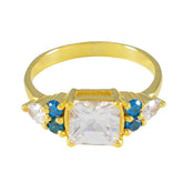 Jia gold ring featuring a blue gemstone statement ring with square clear and round blue stones