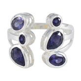 Genesis blue gemstone statement ring with multiple oval and round blue stones set in silver band