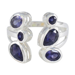 Genesis blue gemstone statement ring with multiple oval and round blue stones set in silver band