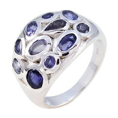 Audrey blue gemstone statement ring with multiple oval and round blue stones in silver setting