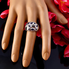 Audrey blue gemstone statement ring with multiple blue stones on silver band displayed on mannequin hand
