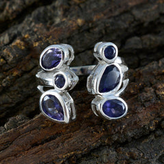 Genesis blue gemstone statement ring featuring multiple oval and pear-shaped blue stones set in silver