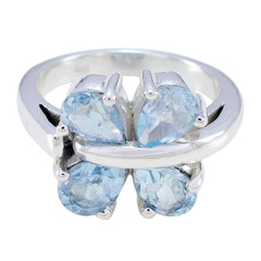 Laura sterling silver ring with four light blue gemstones in a floral cluster blue gemstone statement ring