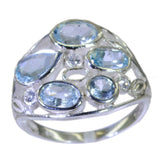 Julieta blue gemstone statement ring with multiple oval and round blue stones in silver setting