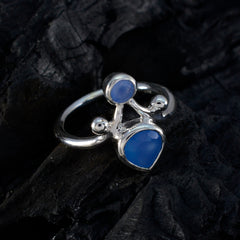 Riley silver ring featuring blue gemstone toi et moi ring with two distinct blue stones on dark background