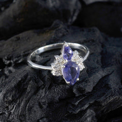 Eun-ji elegant silver ring with blue gemstone toi et moi ring design on black textured surface