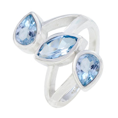 Bianca sterling silver blue gemstone trilogy ring with marquise center stone and two pear shaped blue gems for elegant wear