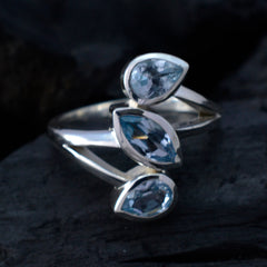 Bianca sterling silver blue gemstone trilogy ring with three pear cut blue stones on adjustable band