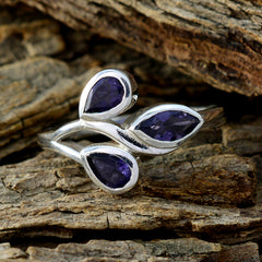 Micaela blue gemstone trilogy ring with three pear-shaped blue stones set in silver band