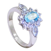 Lili blue gemstone trilogy ring with oval and marquise blue stones set in silver band