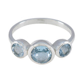 Natcha sterling silver blue gemstone trilogy ring with oval center and two round side stones
