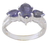 Marie blue gemstone trilogy ring with three oval and pear-shaped blue stones set in silver band