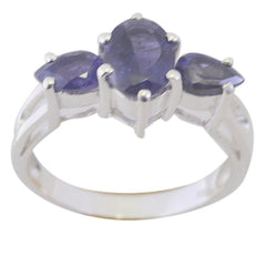 Marie blue gemstone trilogy ring with three oval and pear-shaped blue stones set in silver band