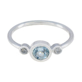 Nari silver blue gemstone trilogy ring with one central blue stone and two clear side stones