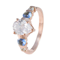 Sofia rose gold ring with pear shaped clear center and blue side stones blue gemstone wedding ring