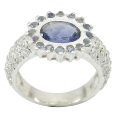 Lucia blue halo engagement ring with oval blue center stone and surrounding smaller blue gems