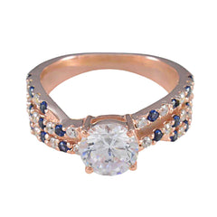 Florencia blue halo engagement ring with rose gold band and sapphire accents
