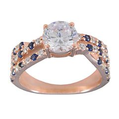 Florencia blue halo engagement ring with rose gold band and sapphire and diamond accents