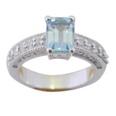 Isabella blue halo gemstone ring with rectangular light blue center stone and diamond accents